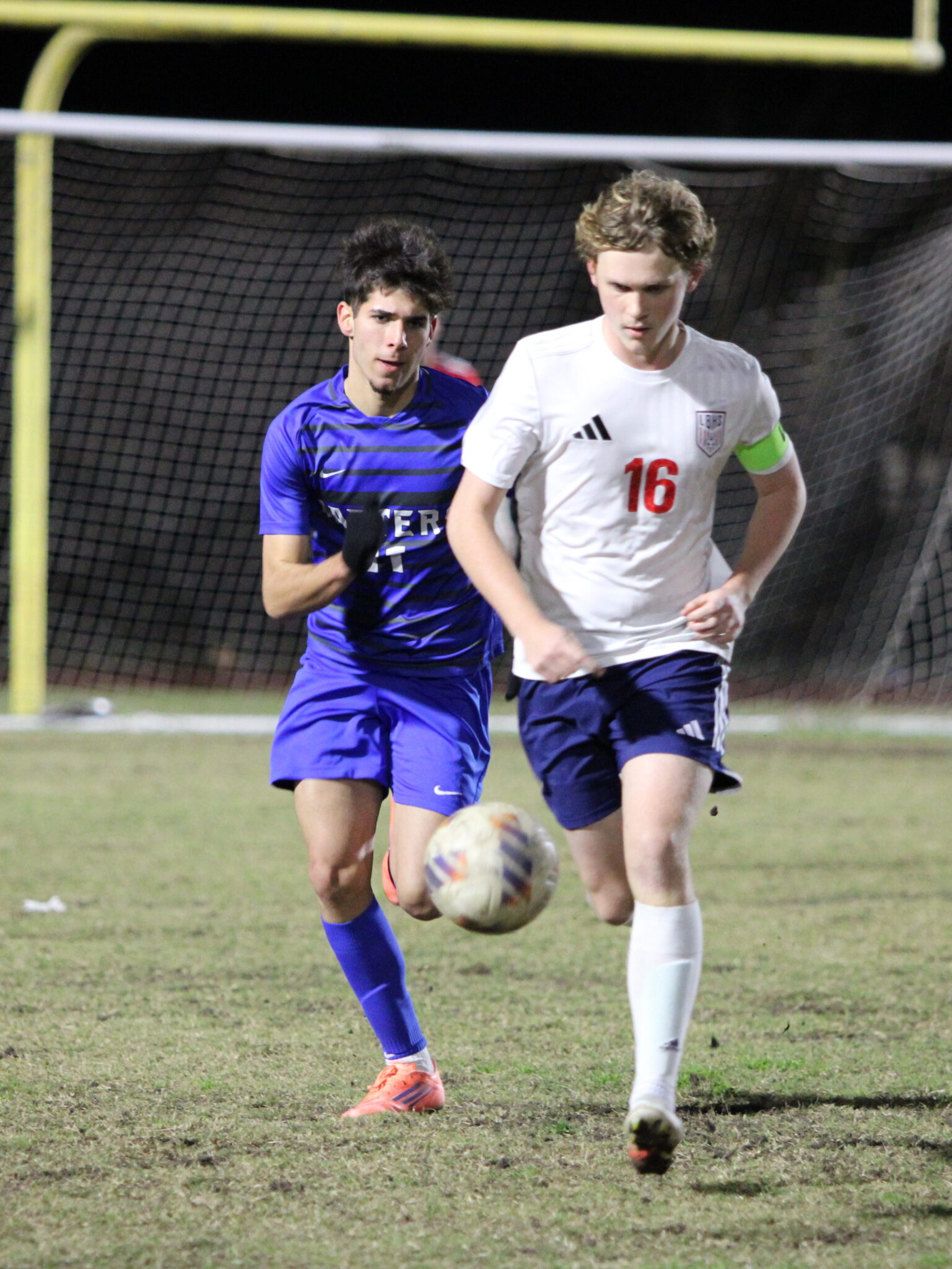 David Campana races a Patriot for the ball