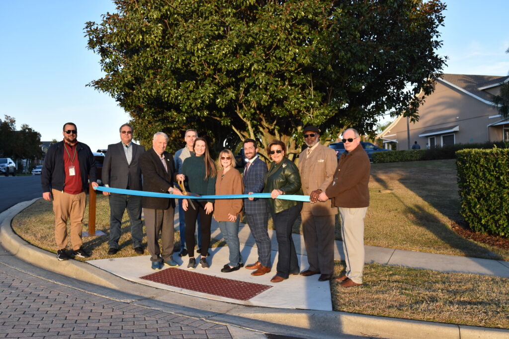 City officials and Emerson Park homeowners cut the ribbon at the right-of-way dedication on Tuesday. 
