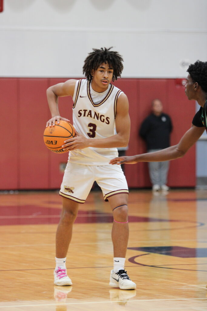 Eric Nichols with a Jones defender on him