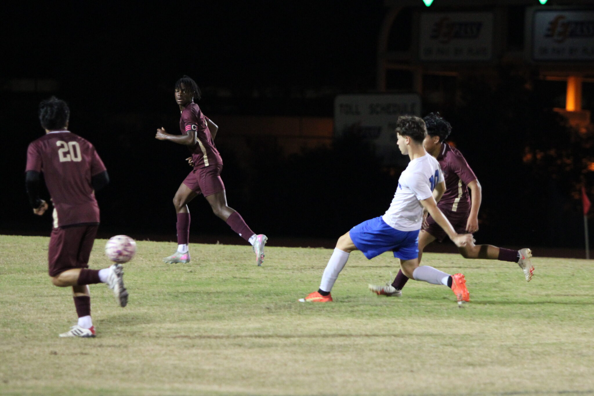 Estevao Amarai attempts a pass through the Mustang defense