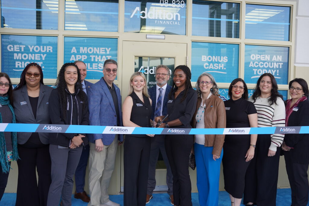 Head tellers Addison Eachus and Chloe Palmer cut the ribbon at the Apopka High branch on Jan. 22.