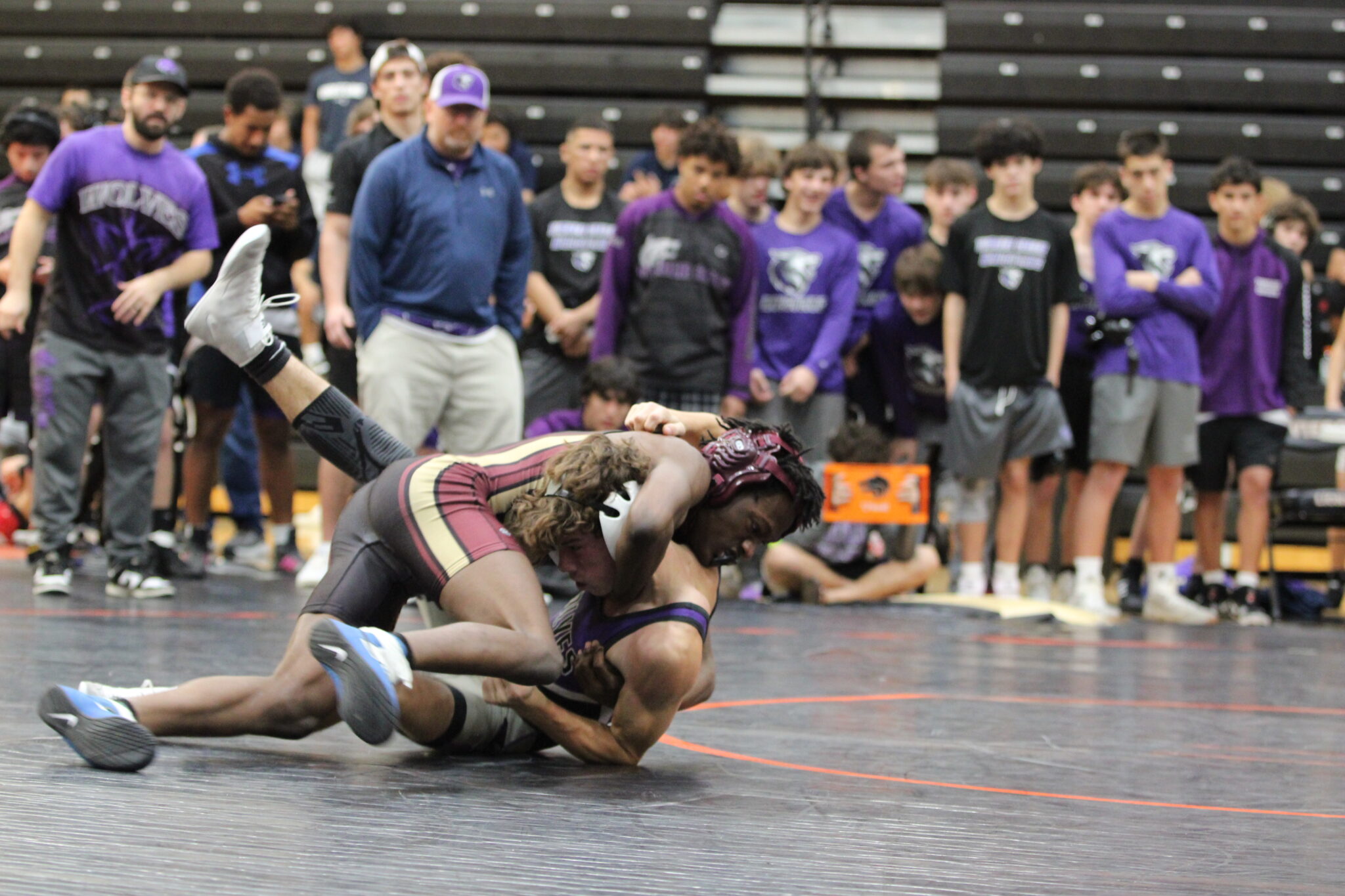 Jeremiah Demosthene locks the head of his opponent to secure position
