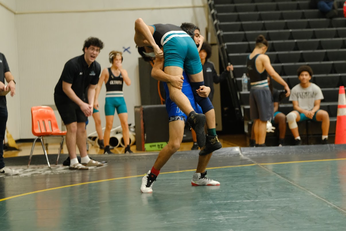 Joel Rivera lifts his opponent for a slam