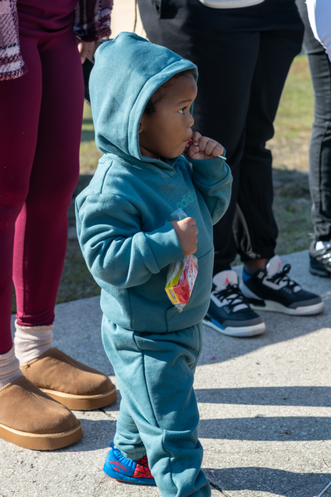 This child is one of many who enjoy treats given to them at the parade.