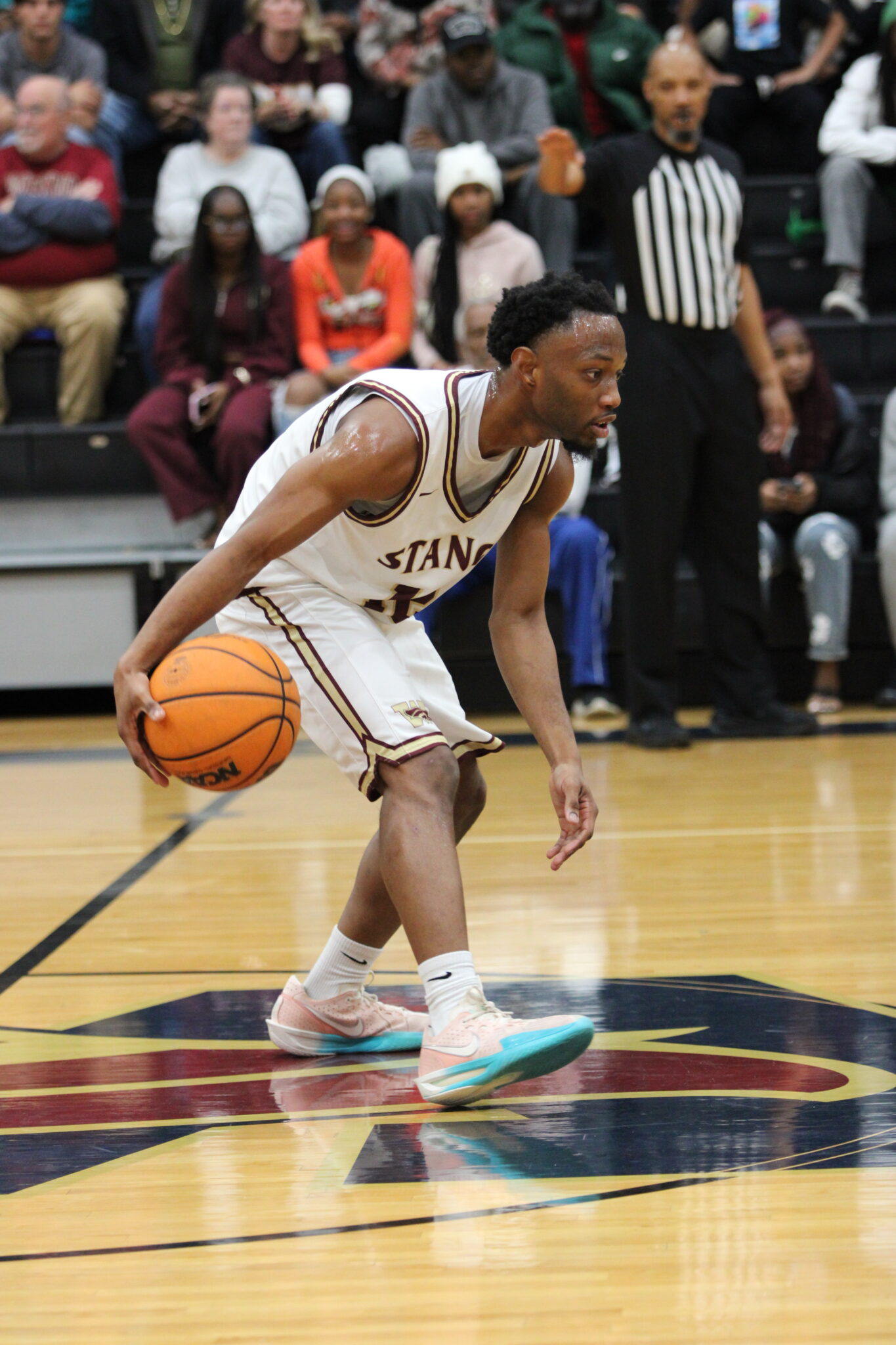 Markel Anderson dribbles calmly past half court