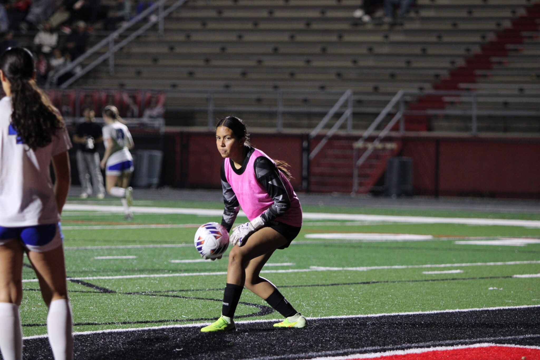 Nicole Garcia rolls a pass over to Nevaeh Nguyen