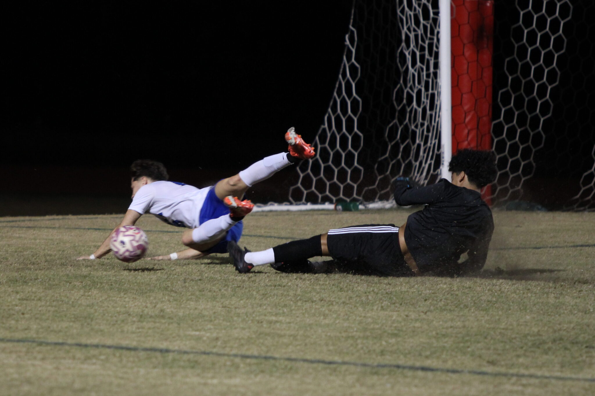 Sebastian Galves and Estevao Amarai collide in the box