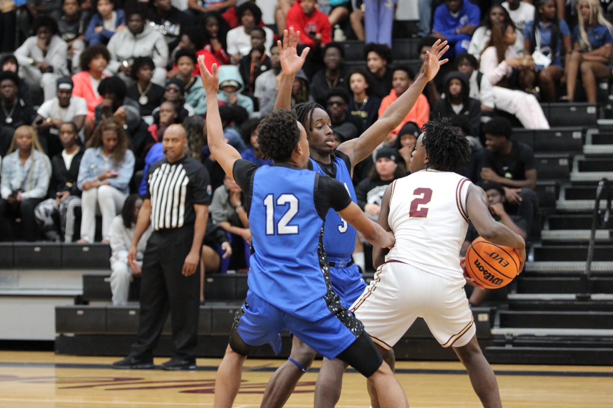 Xavier Bell and Trent Jean trap Saint Pierre at midcourt