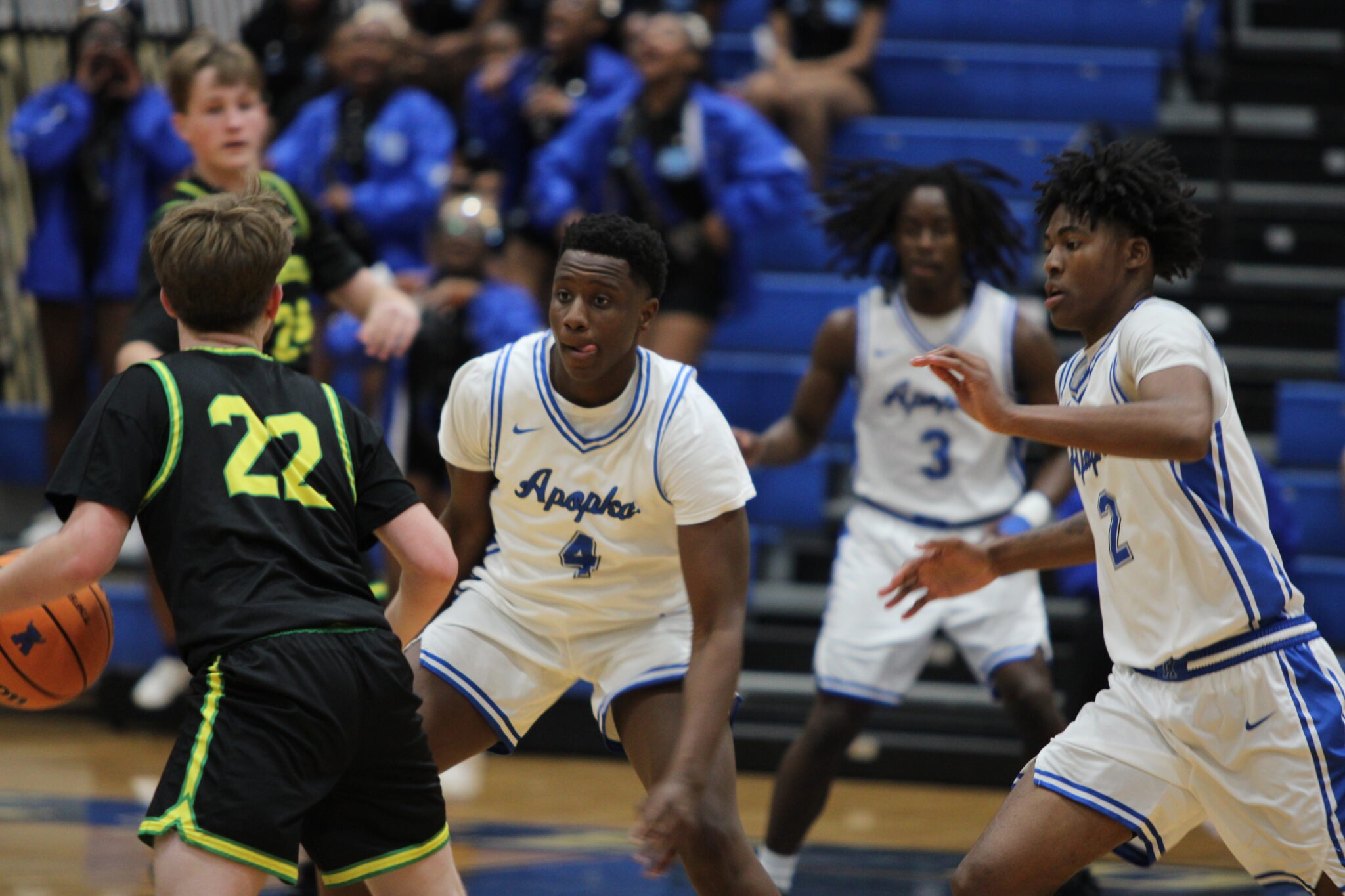 Zee Davis and Jarquavion McClain trap the Hawk ball handler on the perimeter