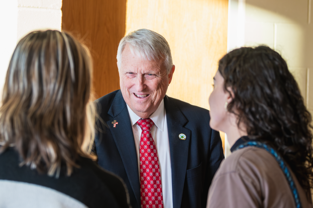 Mayor Bryan Nelson speaks with debate attendees at Apopka High School on Feb. 3.