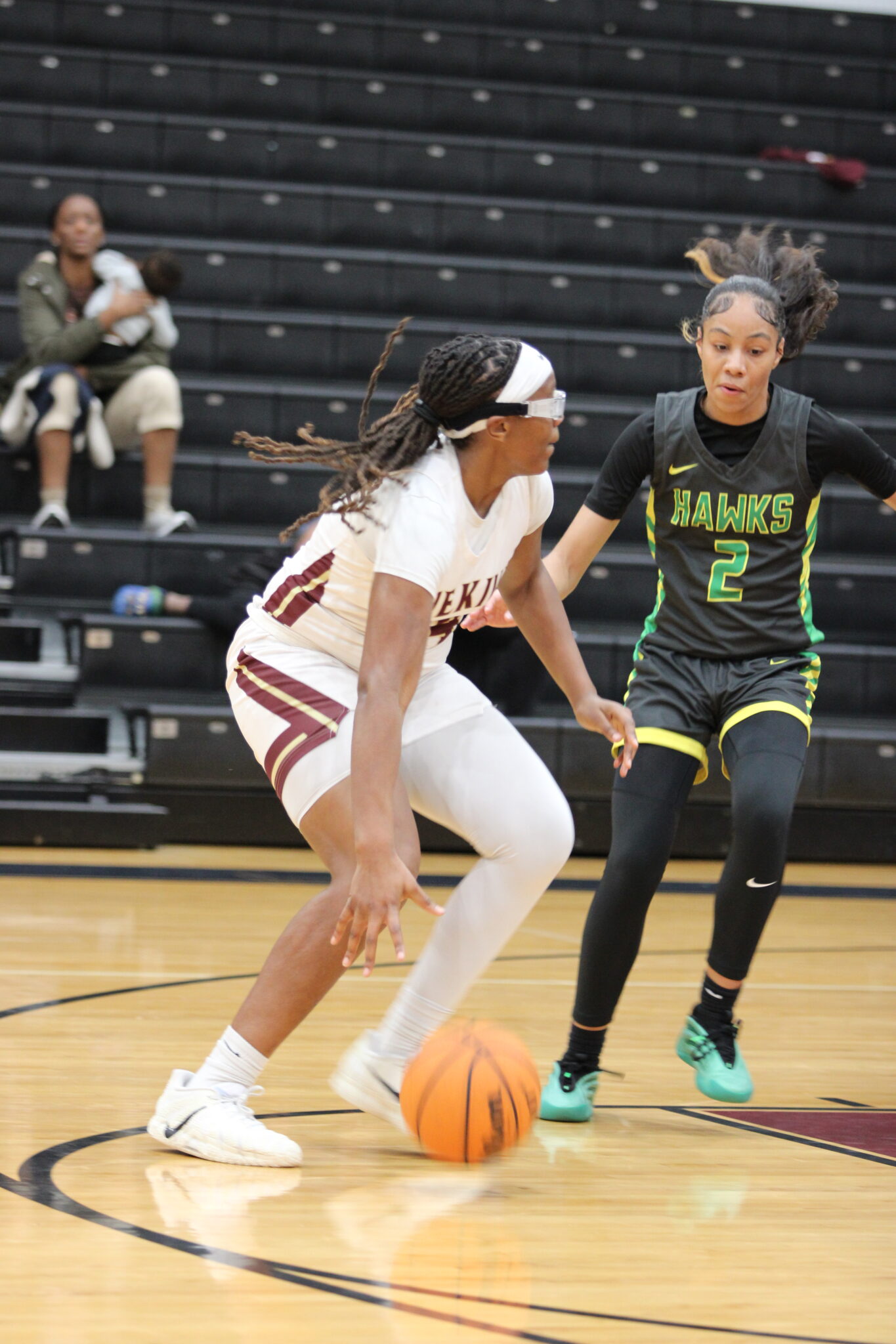 Alexis Hill takes on the Hawk defender