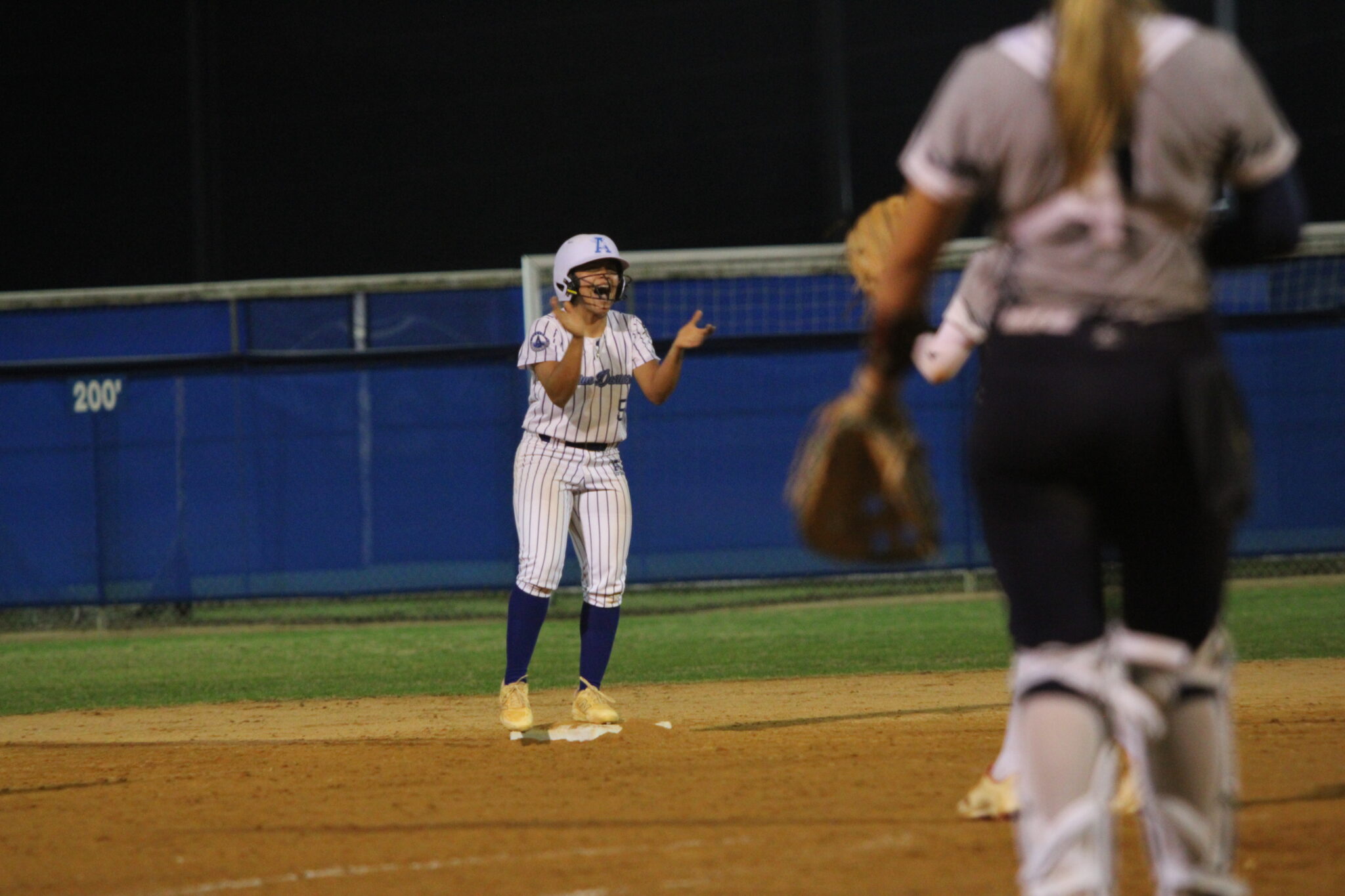 Alicia Lopez hyped up over her huge double in the sixth inning