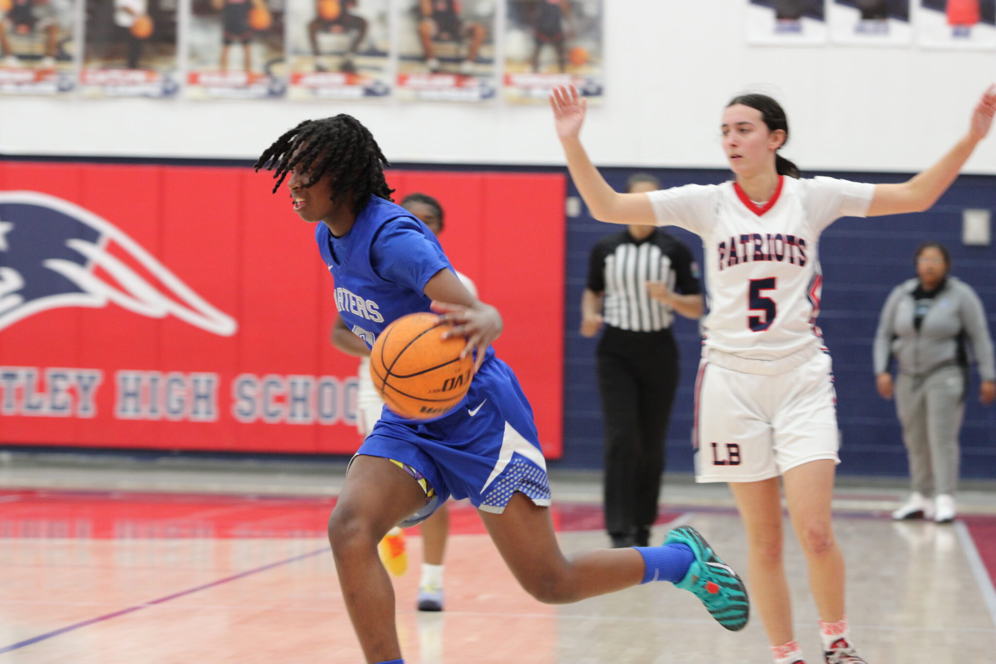 Amari Dillon makes a move past a Patriot defender