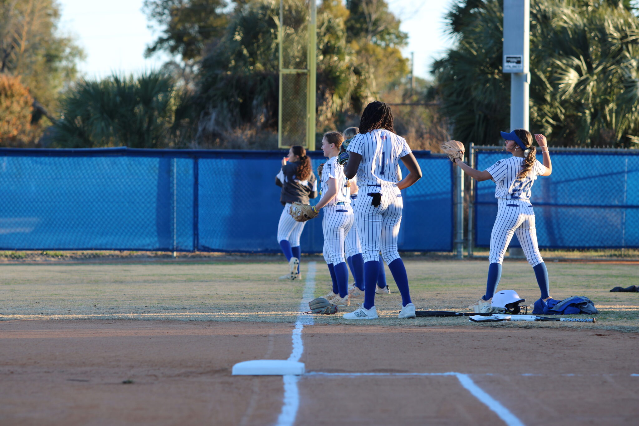 Blue Darters softball warms up for their exhibition game