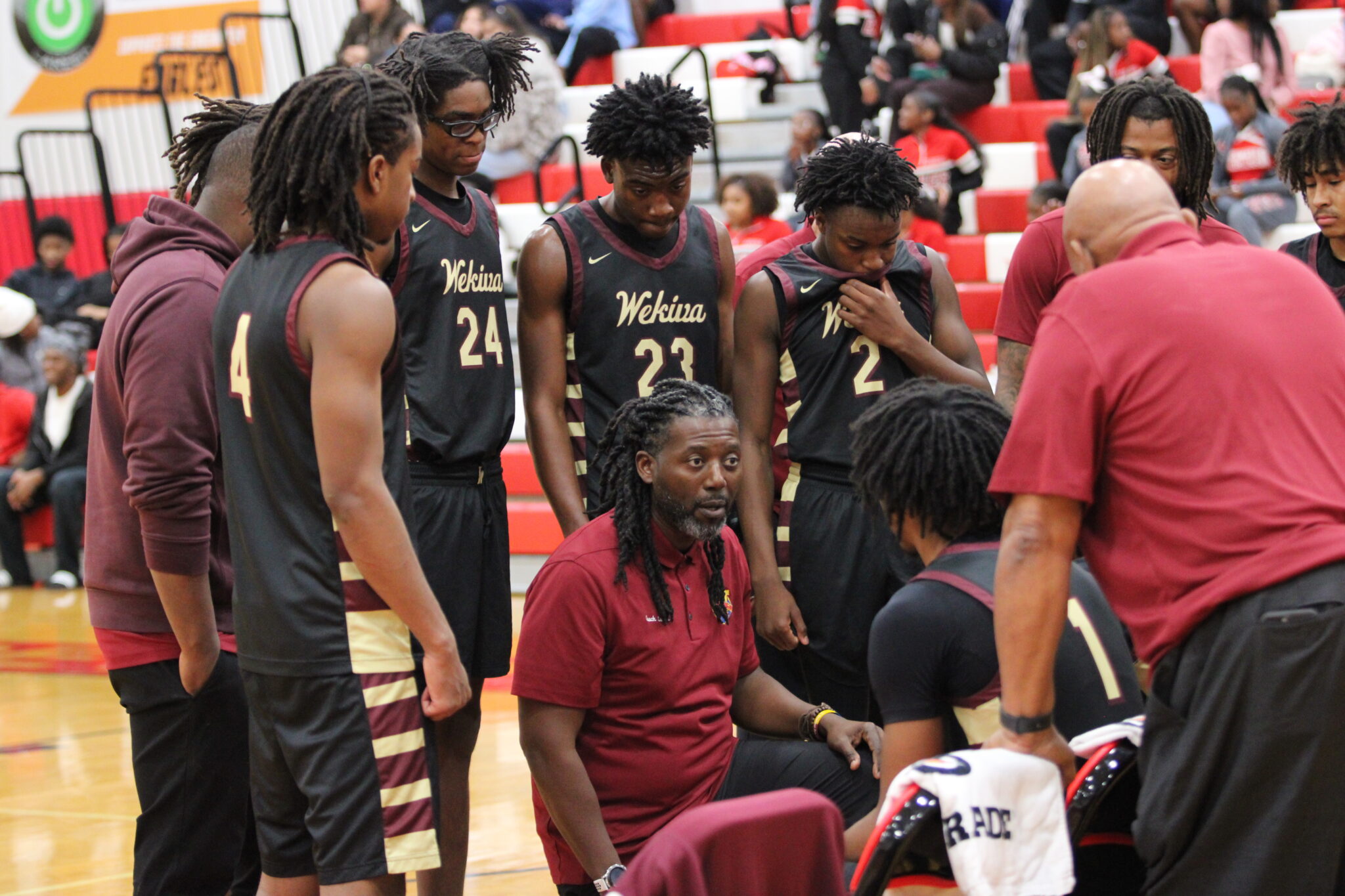 Coach Gersino Lubin talks his team through being down after the first quarter