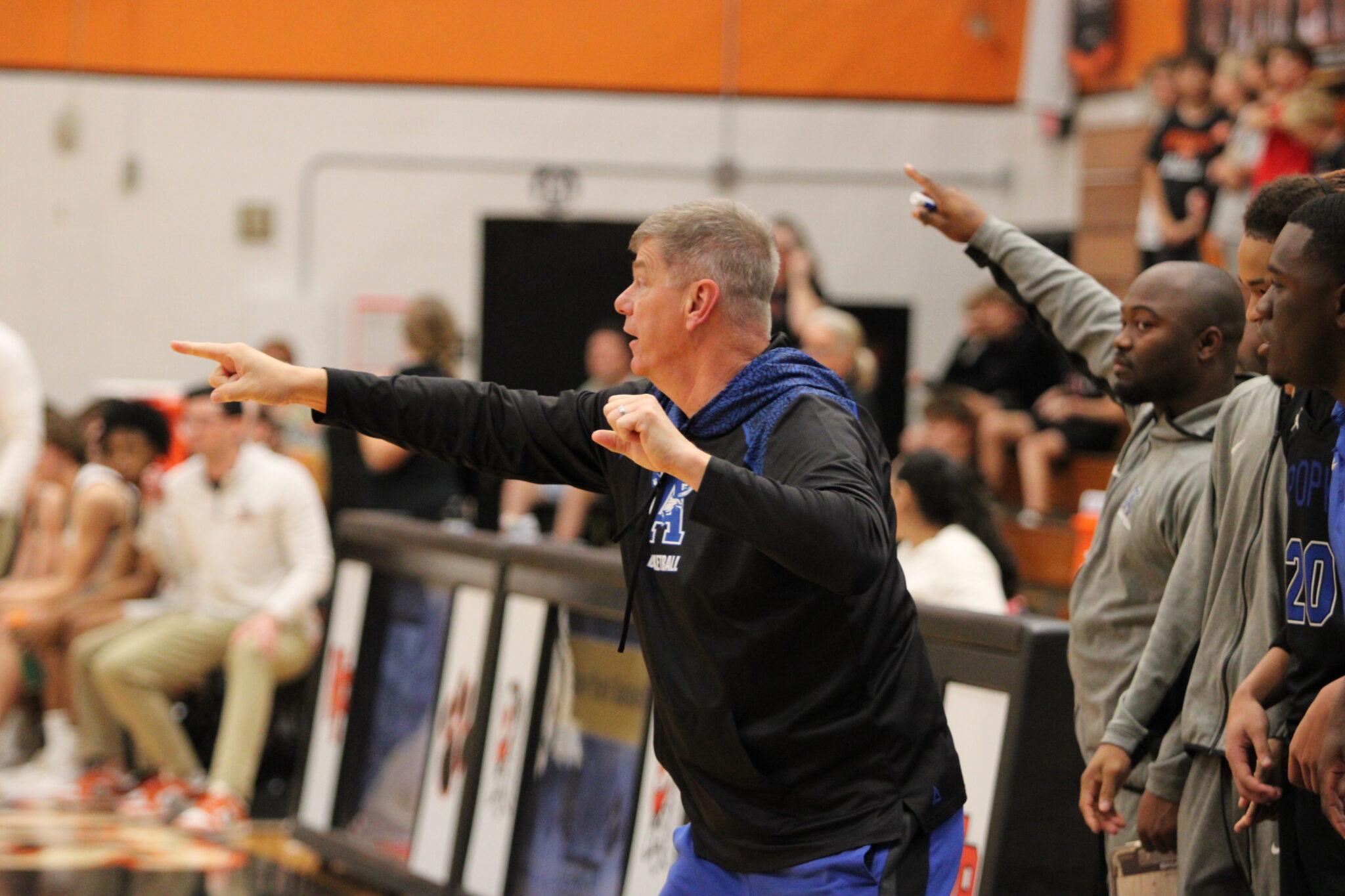 Coach Scott Williams points out the defense and commands his team in the second half