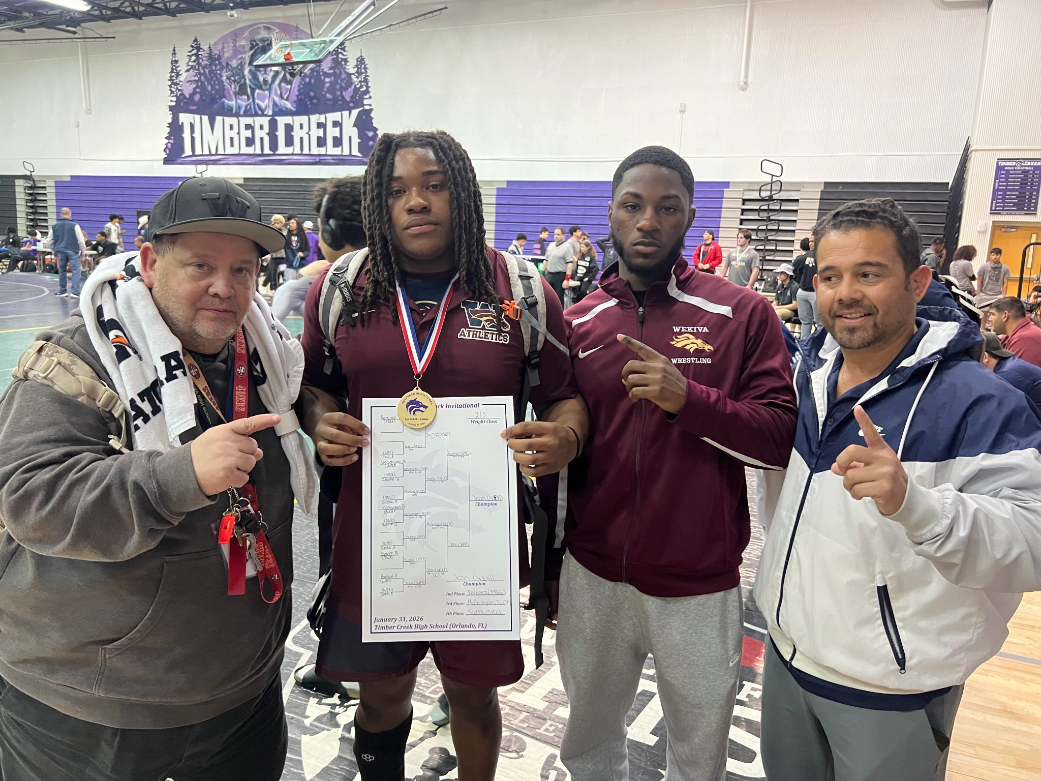 Coach Tony Imbriani, Elija Jean, Wekiva Alum Demarcus Stokes, and Coach Lenin Vazquez after the big day