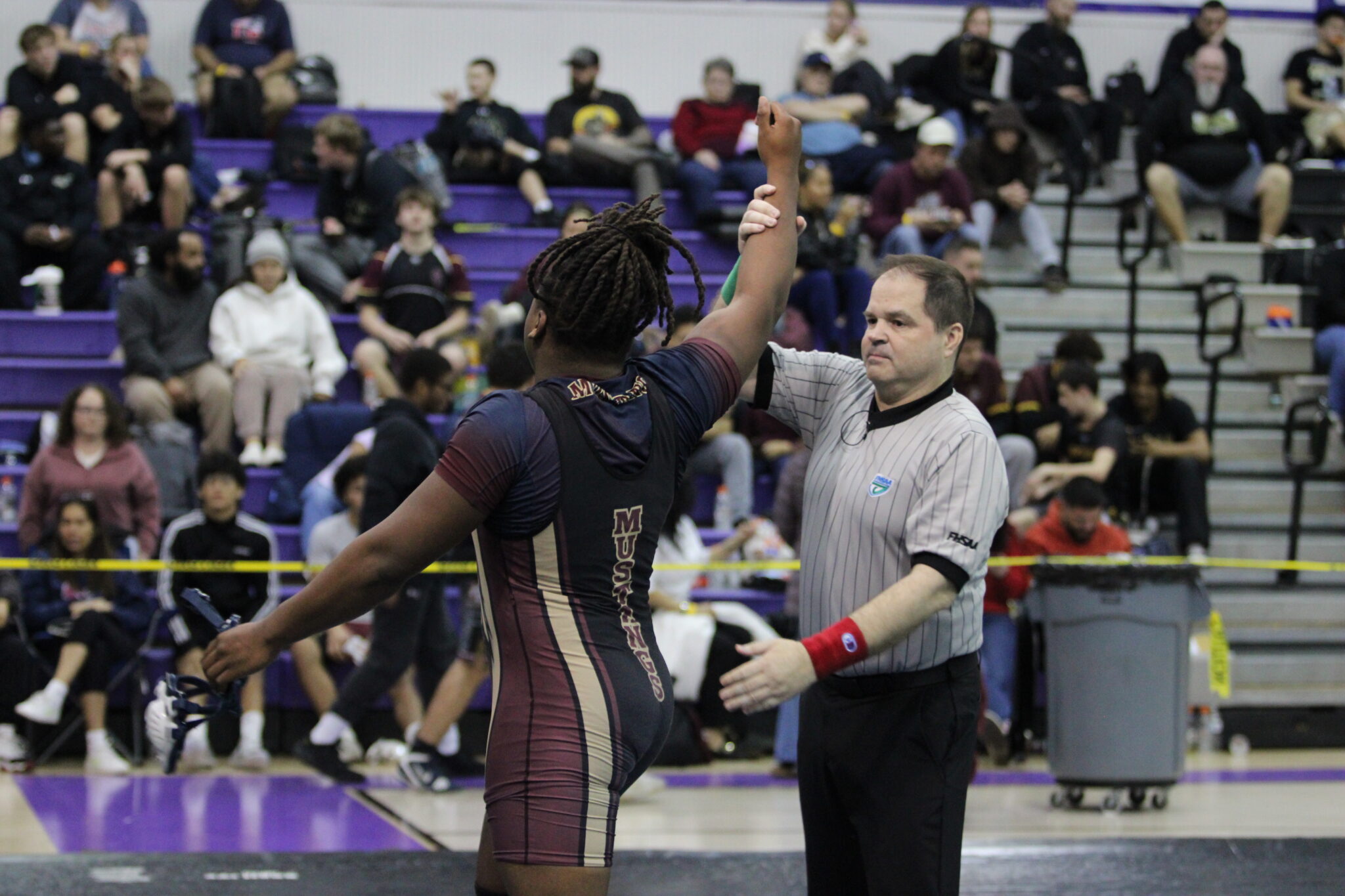 Elijah Jean gets his hand raised to advance to the 215 lb final