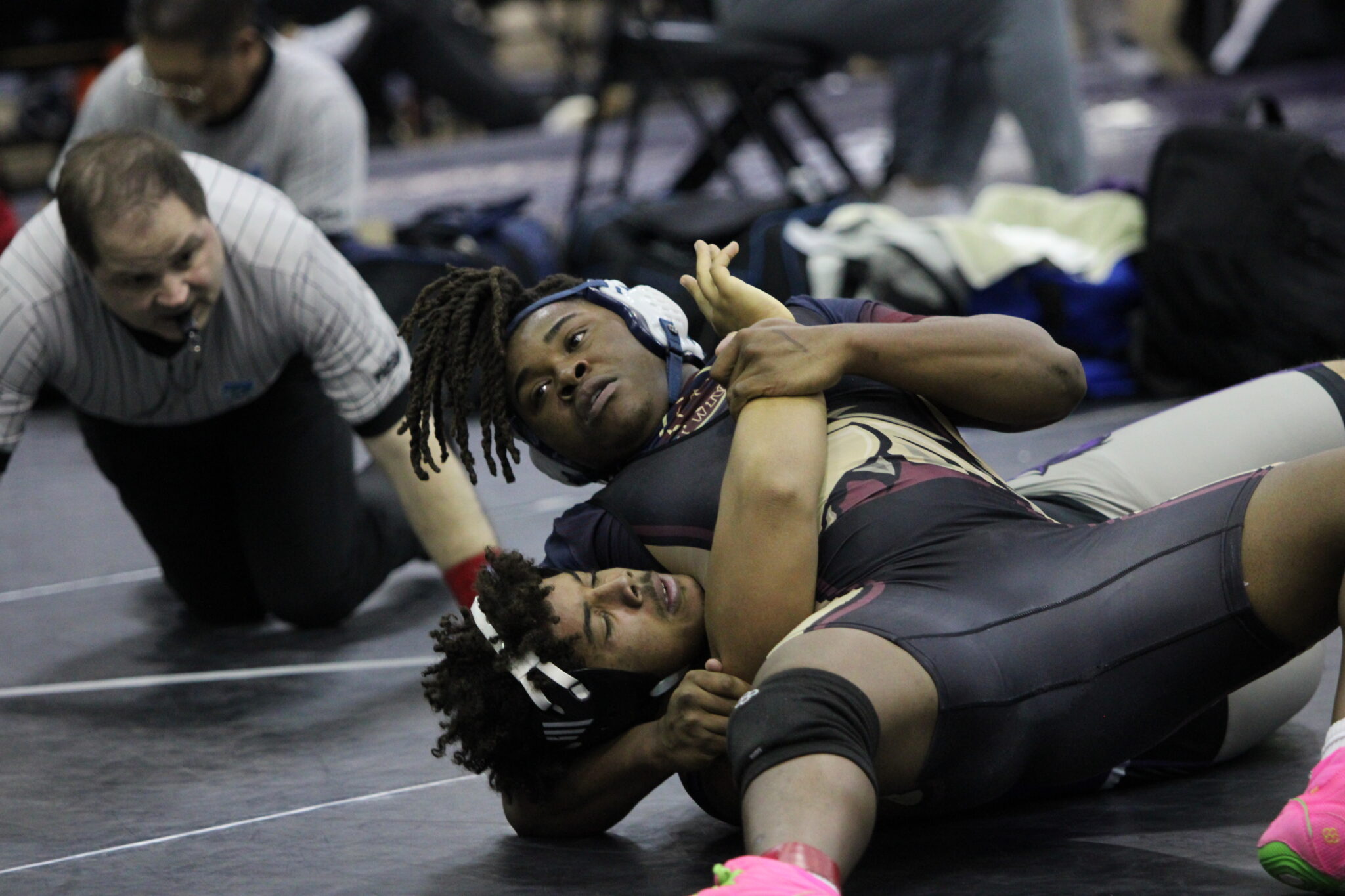 Elijah Jean works the pin after his fourth takedown in the quarterfinals