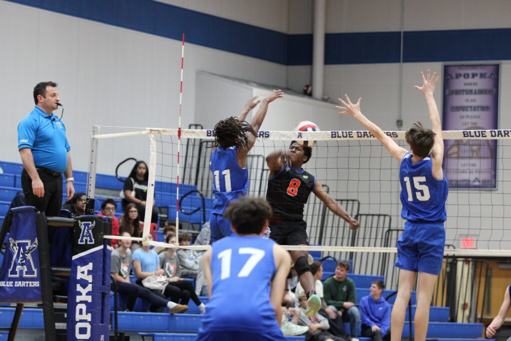Elzie Robinson (11) stuffs a kill attempt from West Orange
