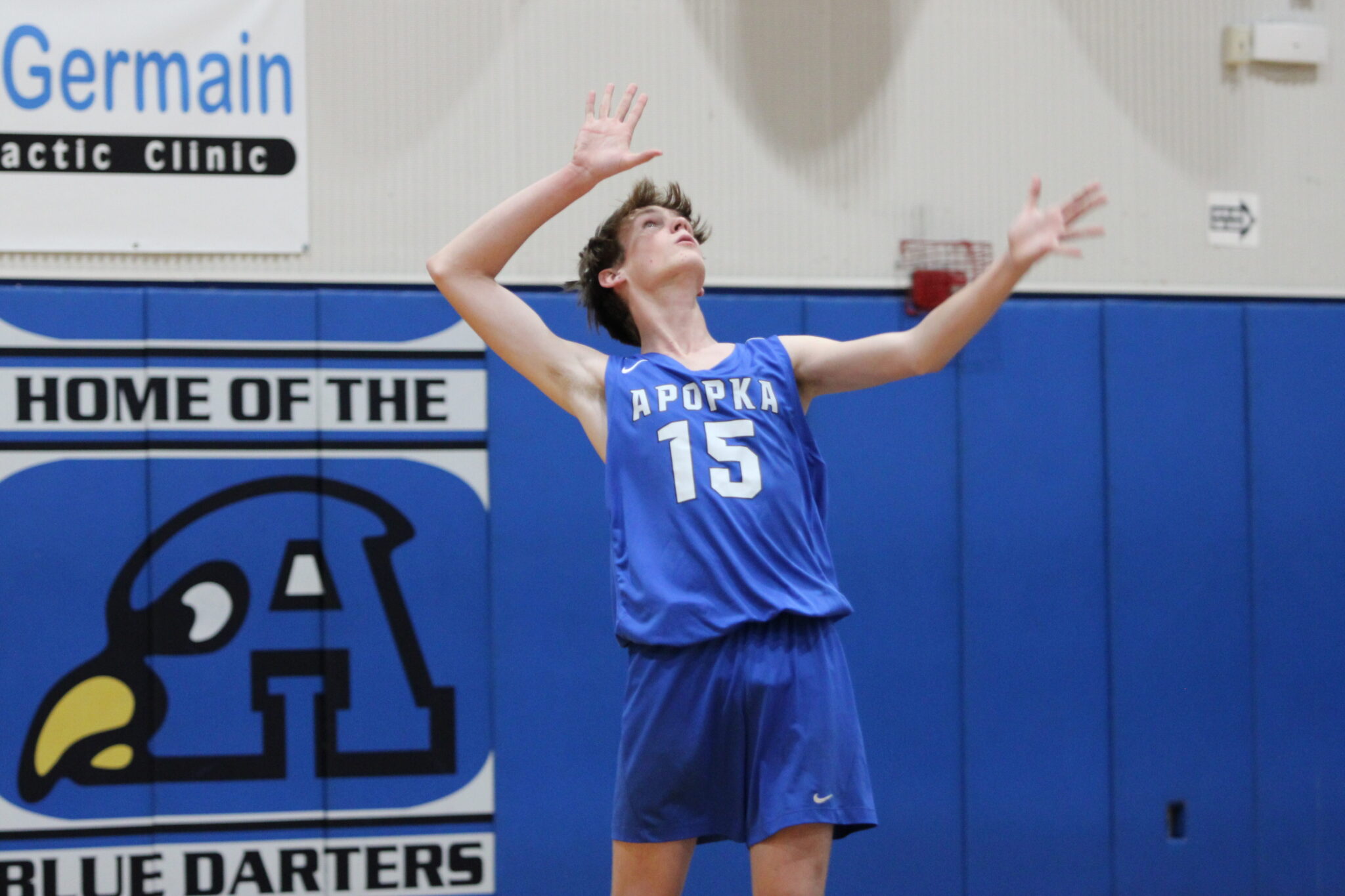 Ian Cottman winds up to whip his serve over the net against West Orange