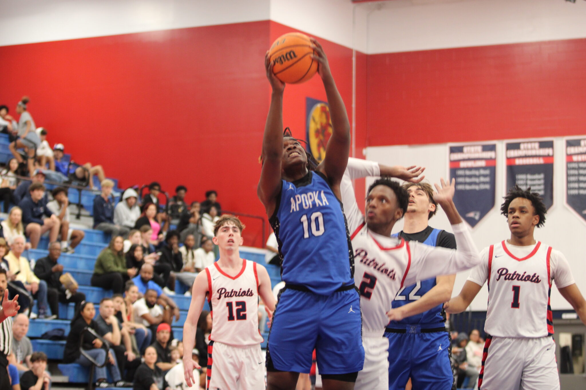 Jacques Evariste finishes strong inside the paint in the first half against Lake Brantley