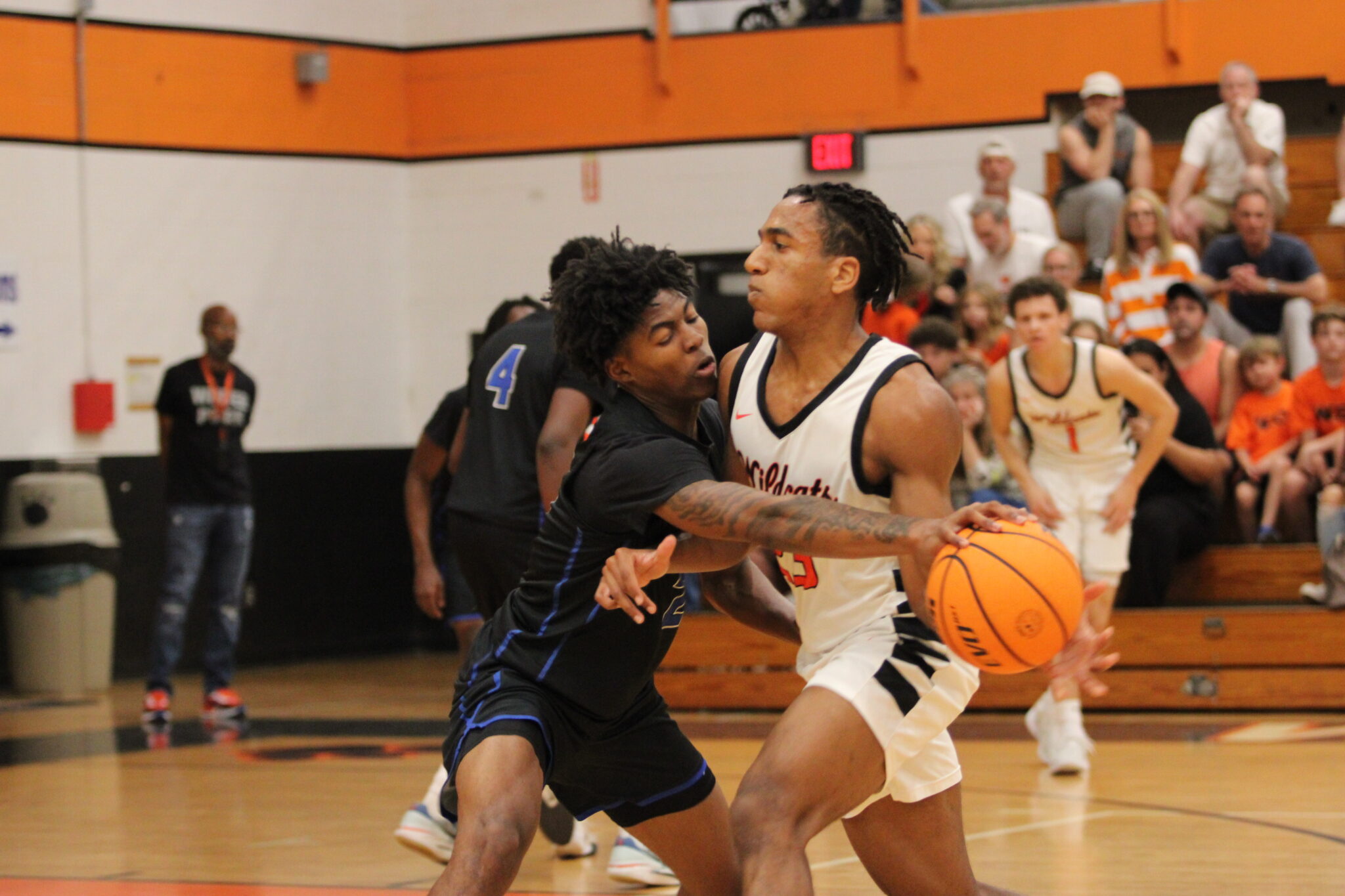 Jarquavion McClain reaches in to poke the ball away from the Wildcat