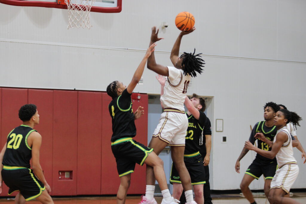 Jasen Francillon muscles through two defenders for the basket