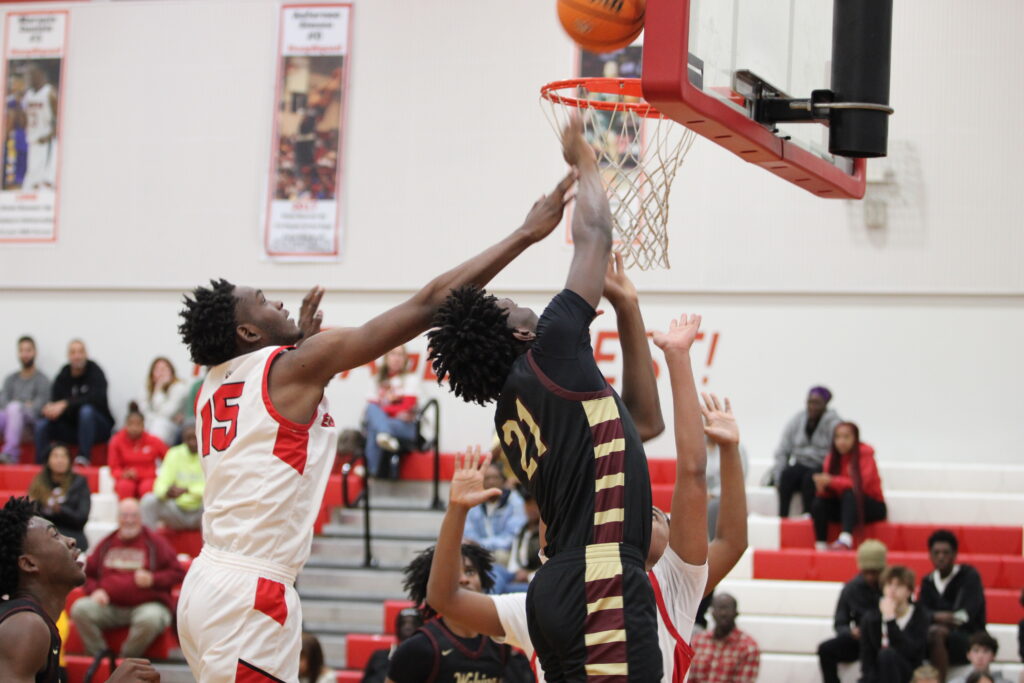 Kenny Dieujuste gets strong and finishes the layup after an offensive rebound