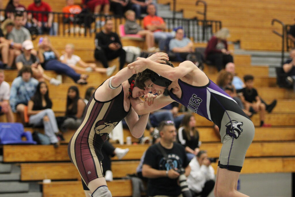 Landonn Shultz faces off with a Timber Creek Wolf in the 3rd place match at the District Tournament