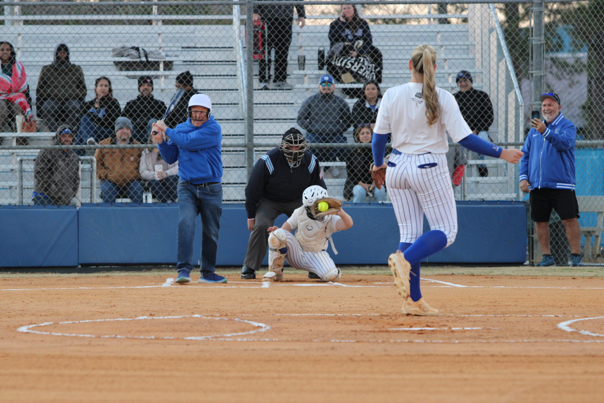 Mayor Brian Nelson whiffs on Ava Millspaugh's fastball down the middle