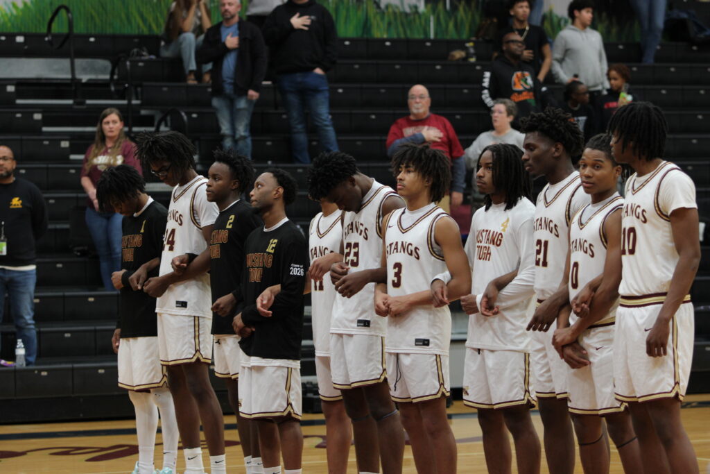 File photo of Mustangs locking arms for the National Anthem