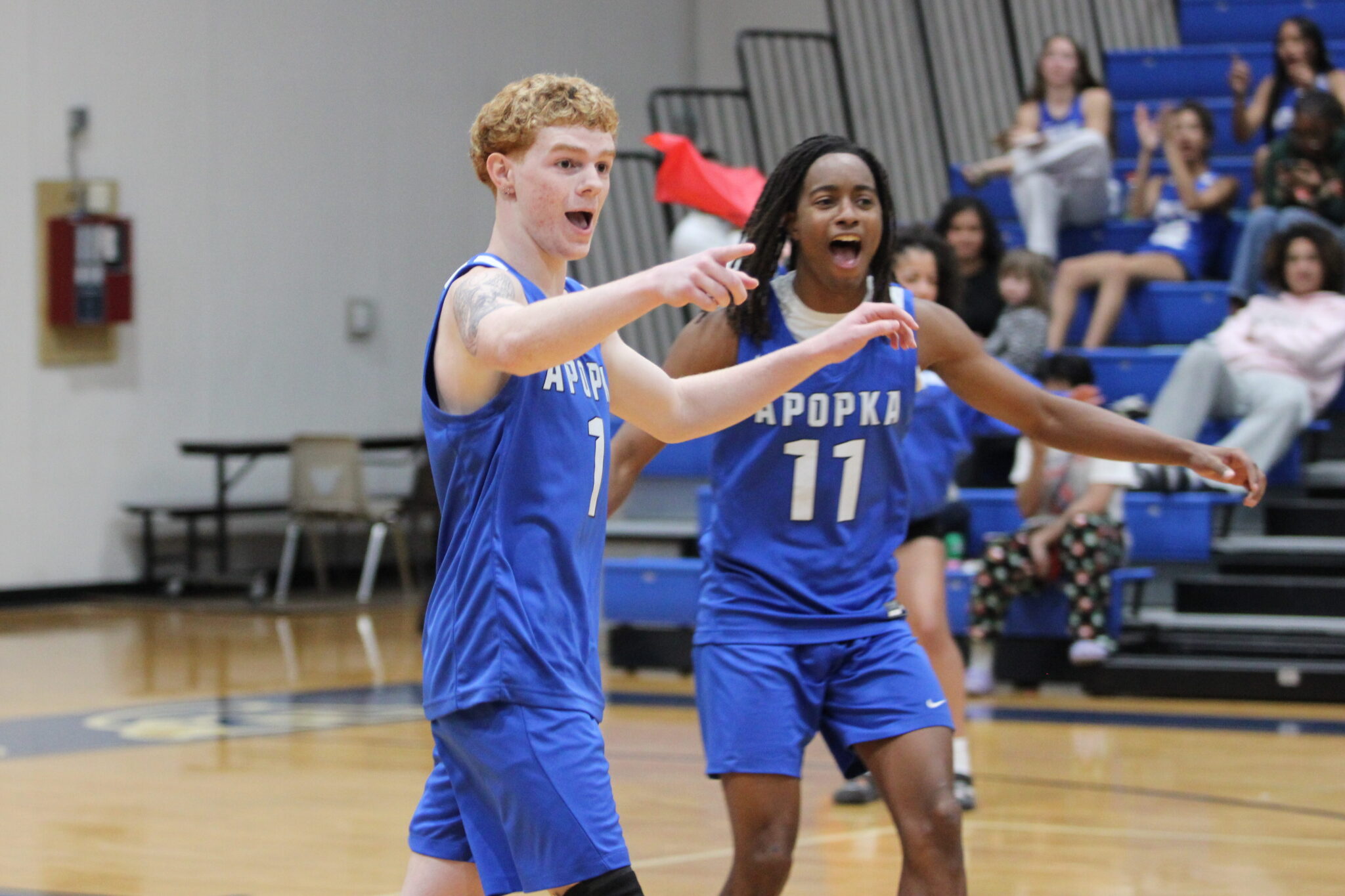 Nathan White points at the player who tipped it on his ace