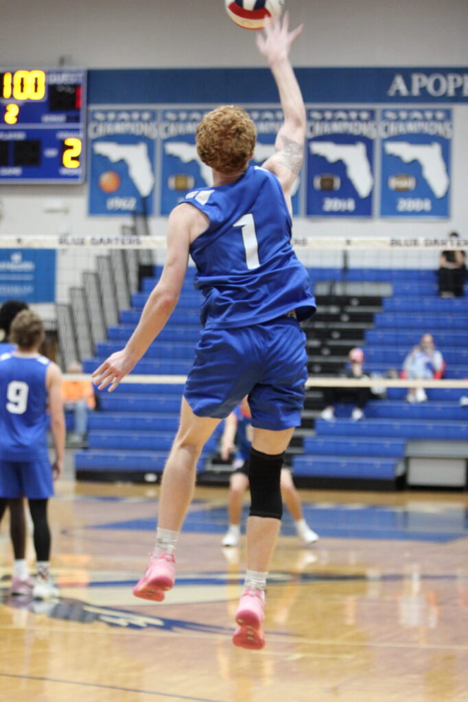 Nathan White smacks his serve to West Orange in the 2nd set