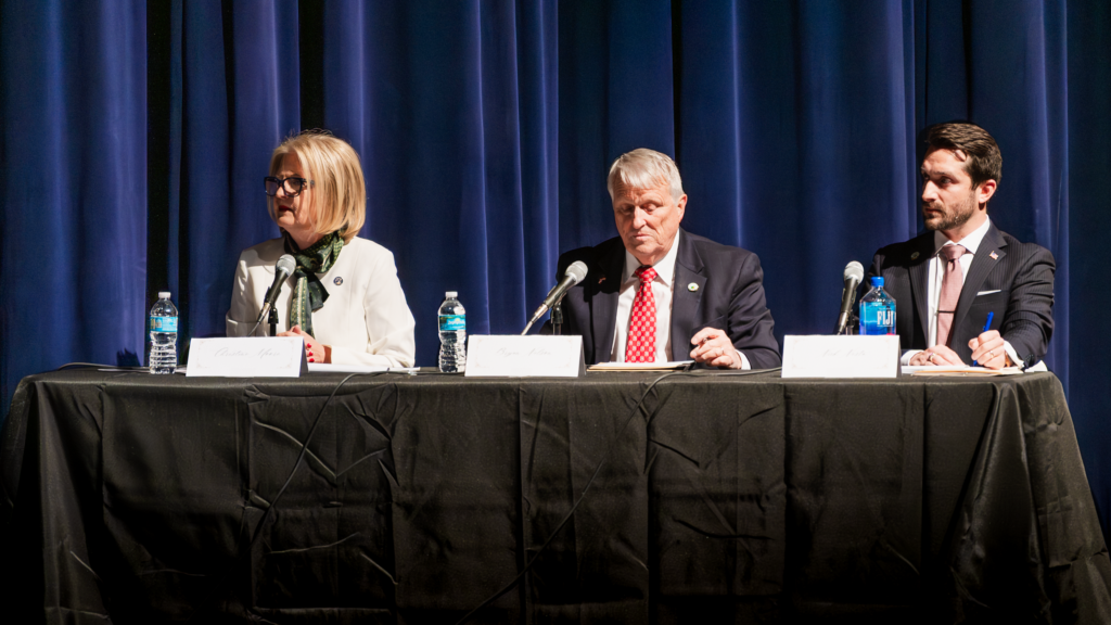 Orange County Commissioner Christine Moore, Mayor Bryan Nelson and City Commissioner Nick Nesta participate in the Feb. 3 mayoral forum at Apopka High School.