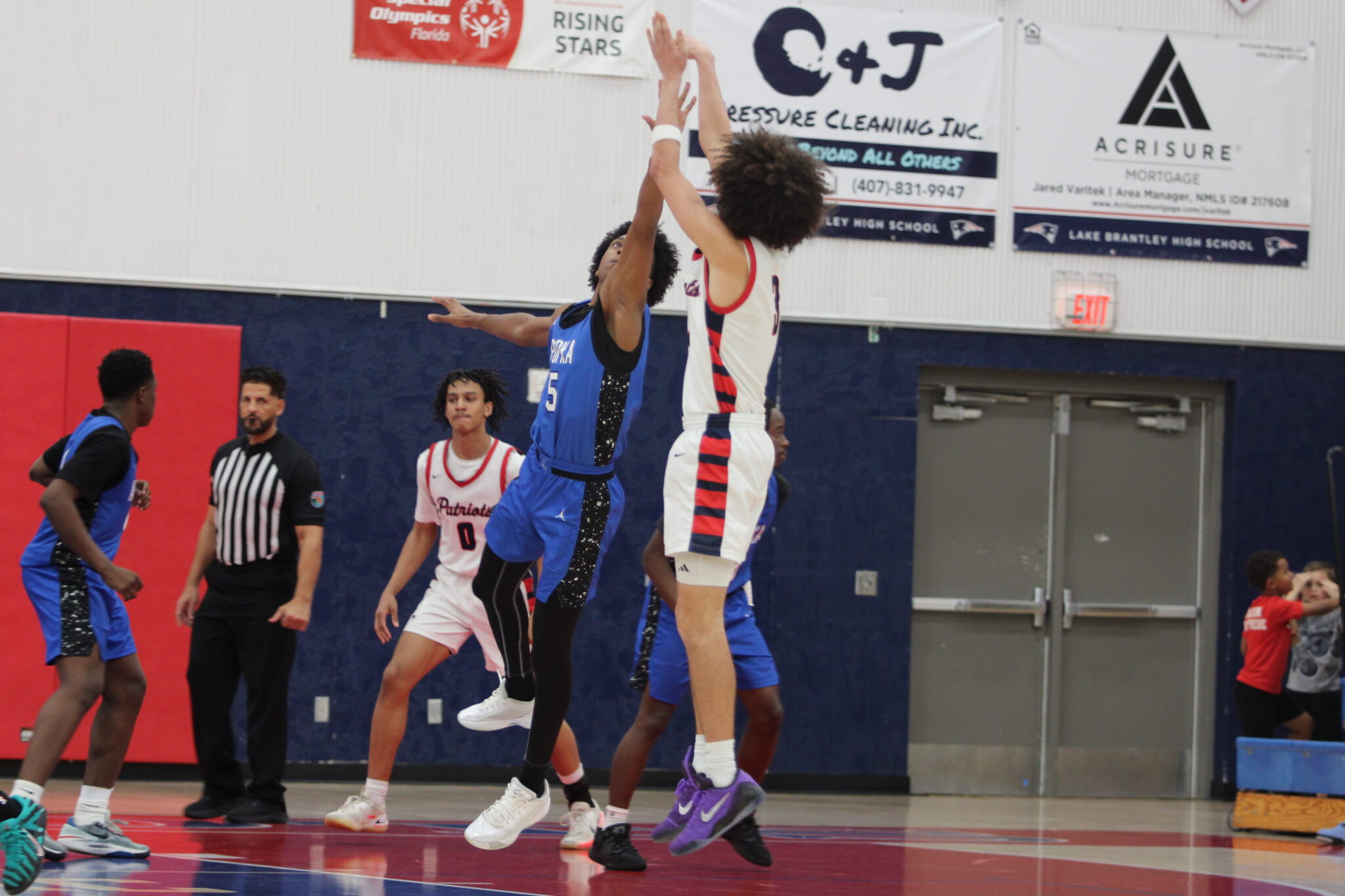 Noah Ferrer contests the shot by Lake Brantley in the second half