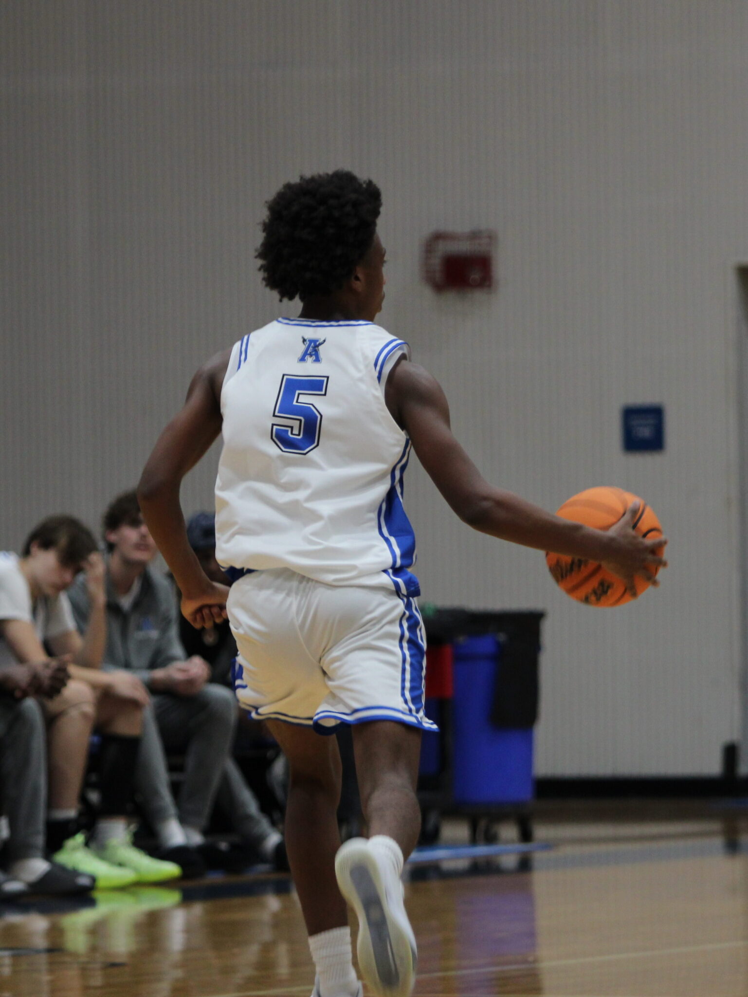 Noah Ferrer dribbles up the court with space to work with