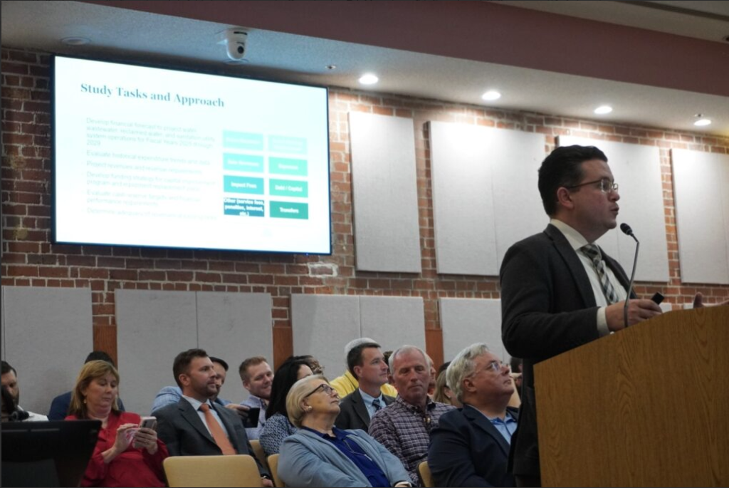 Shawn Ocasio senior consultant with Raftelis Financial Consultants, gives a presentation about the utility rates at a September 2025 City Council meeting.