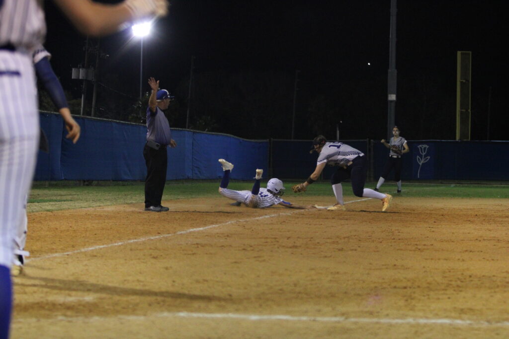 Shylah Pino gets back to third base safely after rounding third off the steal