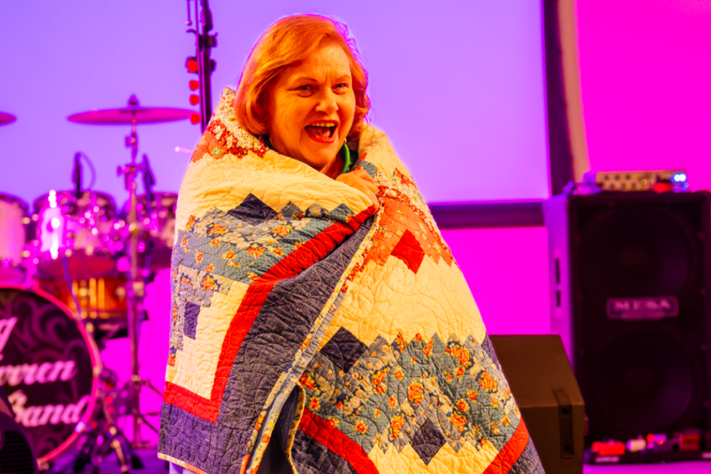 Loretta Forlaw smiles in her newly awarded blanket.