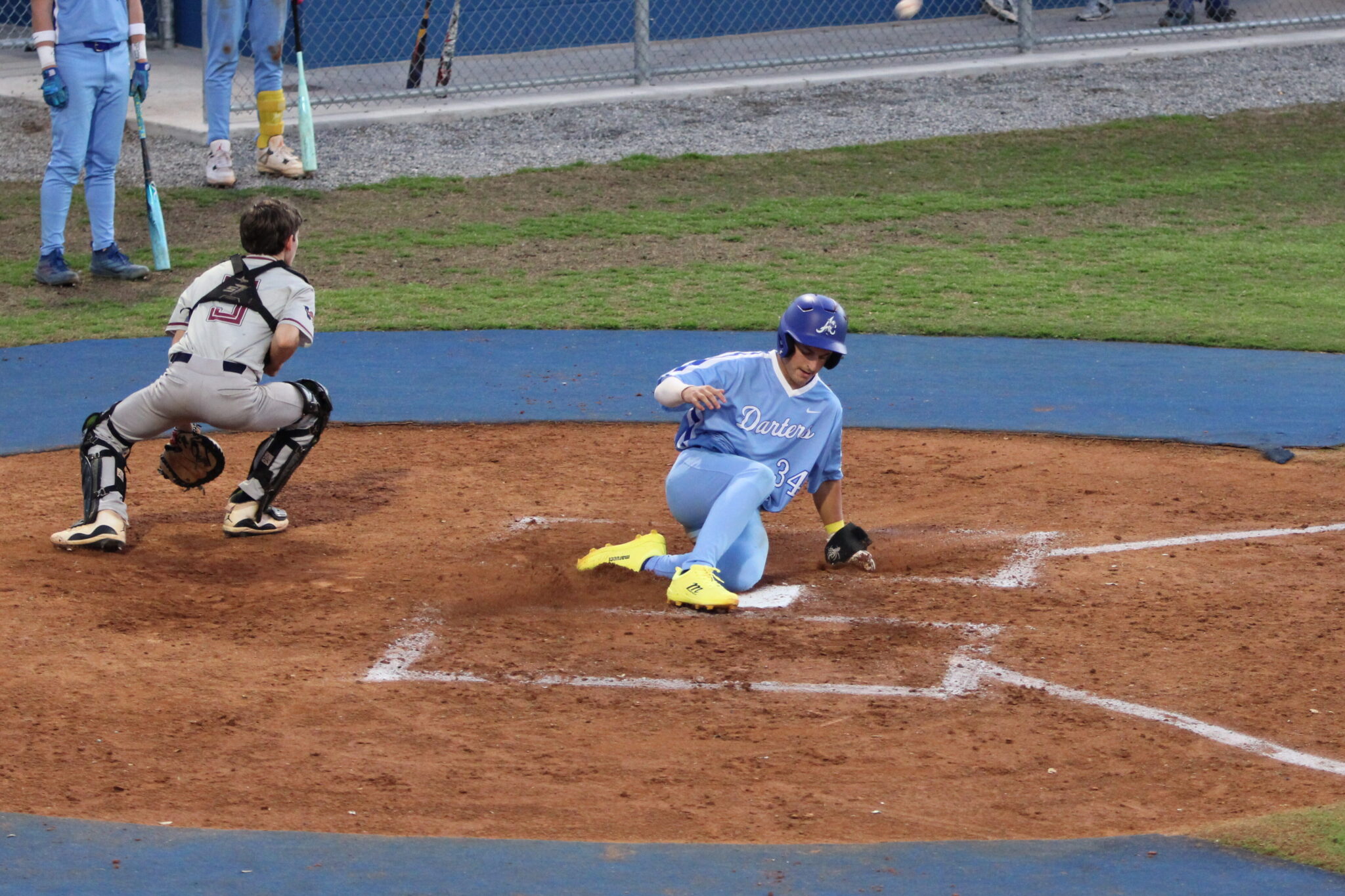 Aiden Rieli slides home in the second inning after keeping his hit streak alive against Wekiva