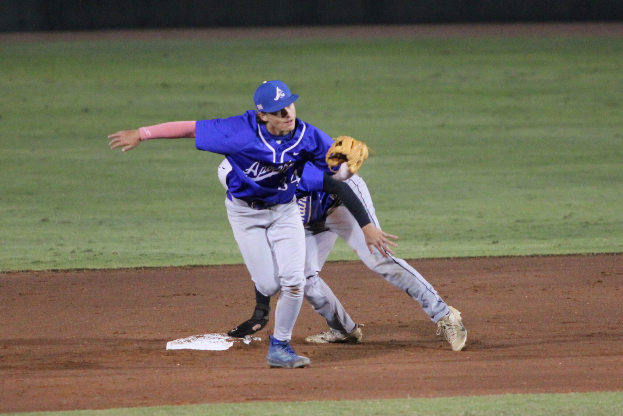 Aiden Rieli tags the runner out after the gunned throw from catcher Collin Van Fleet