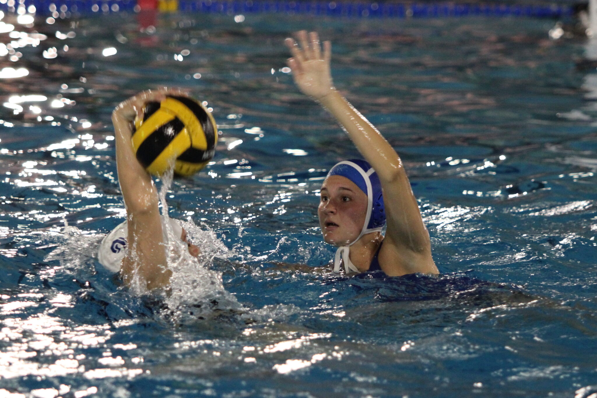 Alexis McReynolds blocks a pass attempt and takes the ball away from the Windermere swimmer