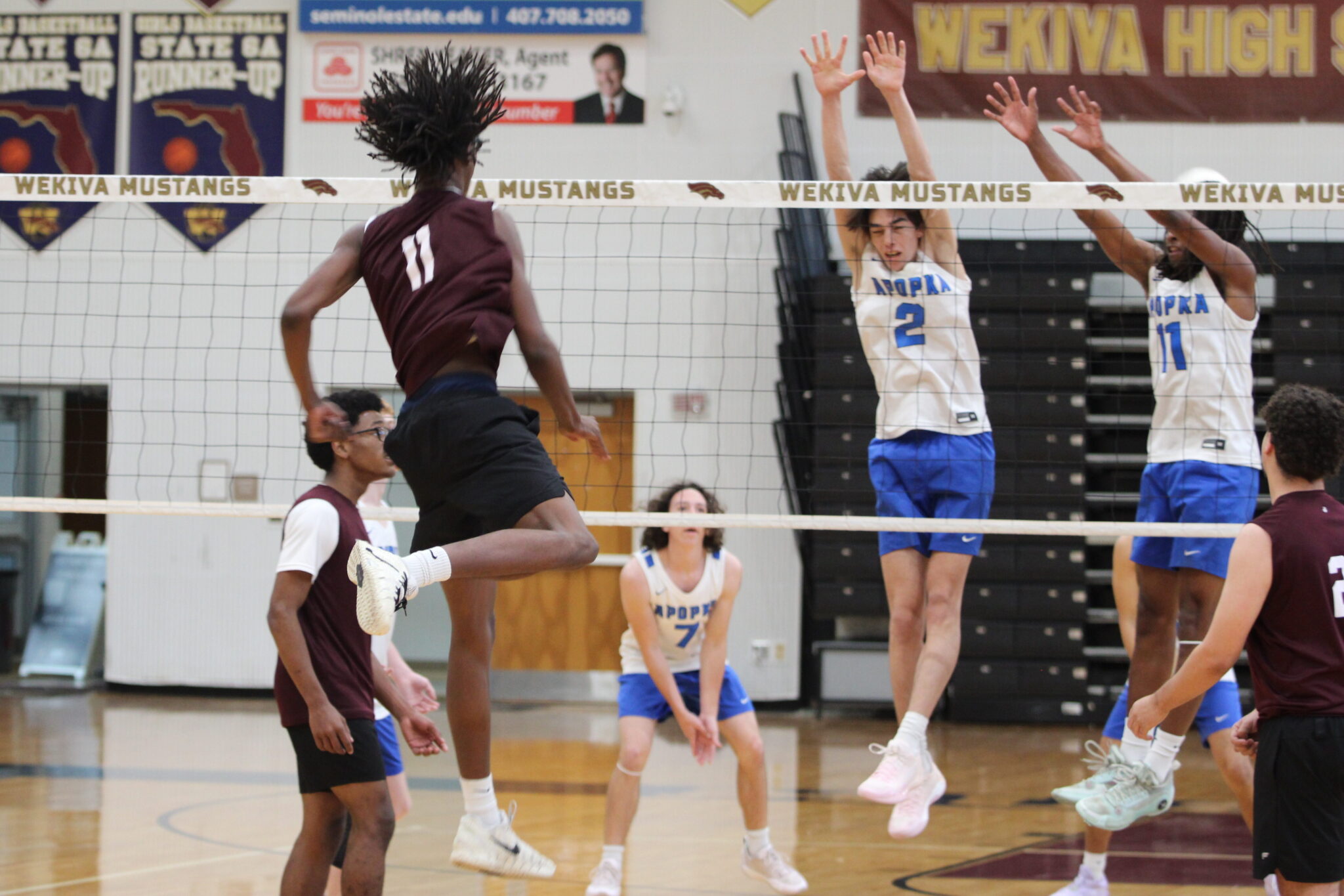 Ameer Garland smashes one past the hands of Quintin Dafrron and Nathan White