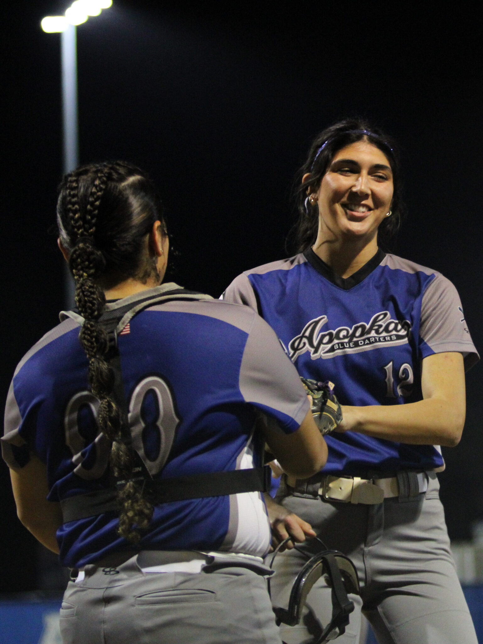 Anamarie Lopez and Mia Aeschilman come off the field after the first 3 strikeout inning