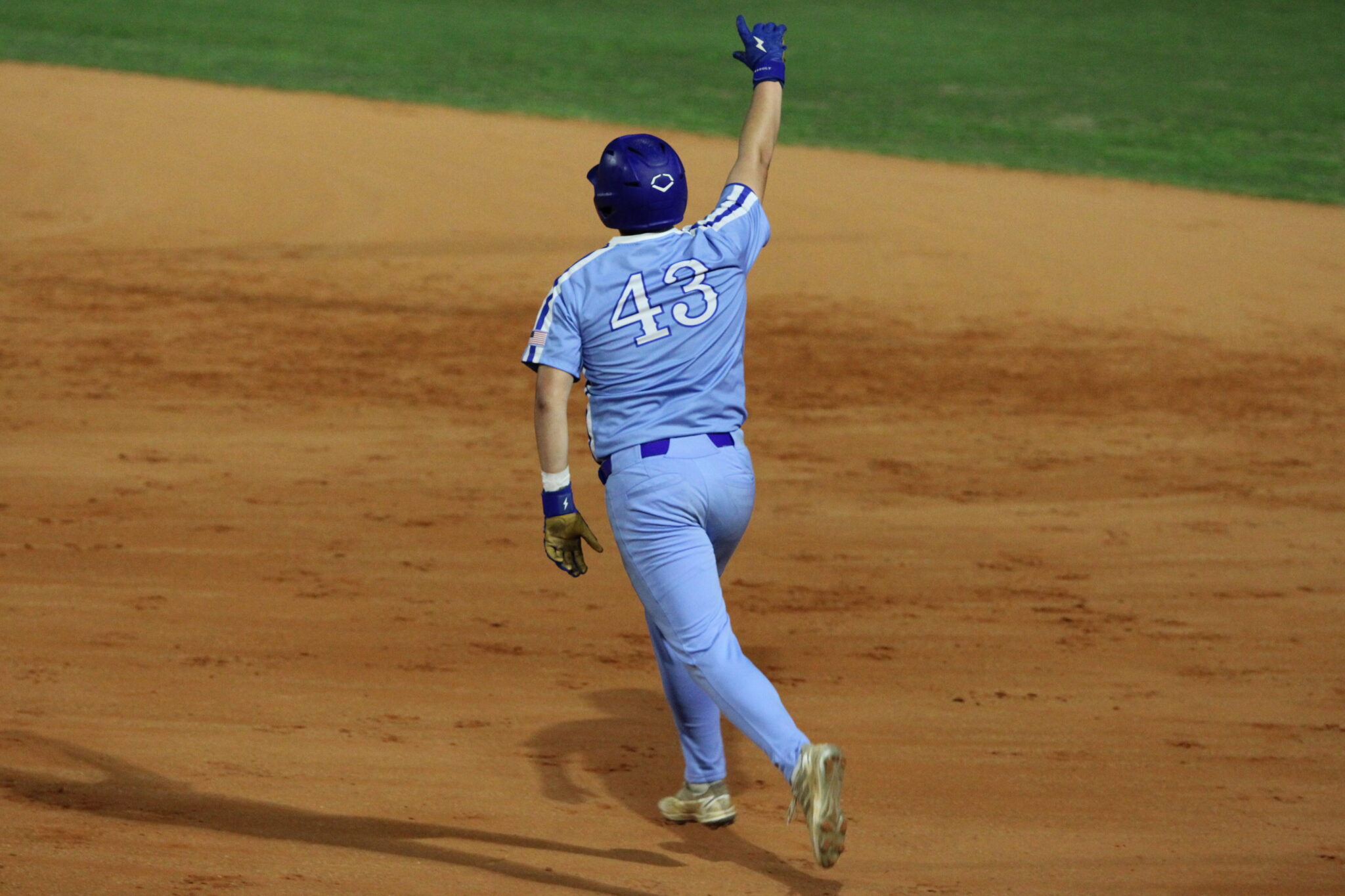 Anthony Raymond points to the sky as he rounds the bases on his game-ending grand slam to left over Wekiva