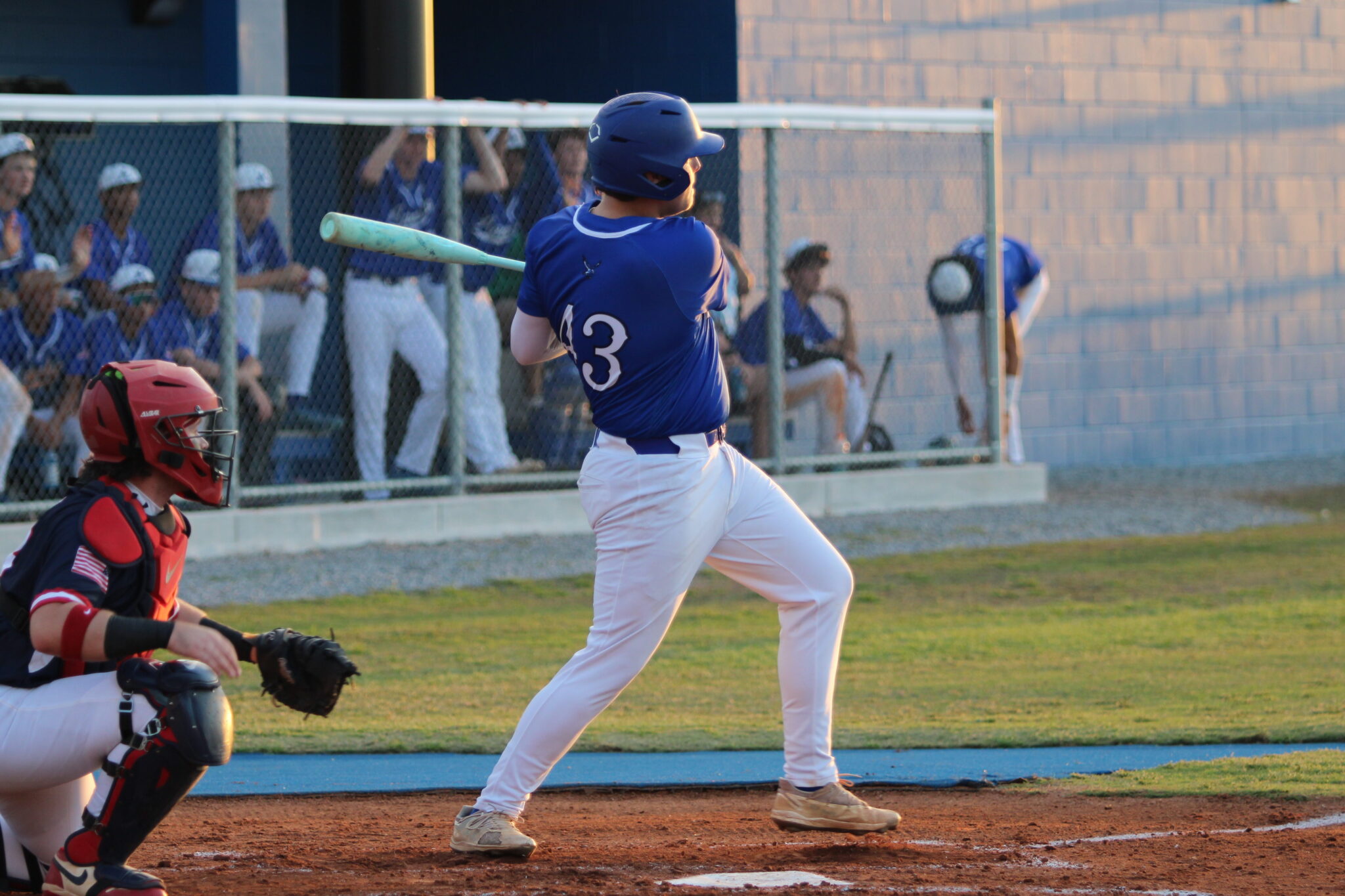 Anthony Raymond rips a ball to left field for a single on senior night