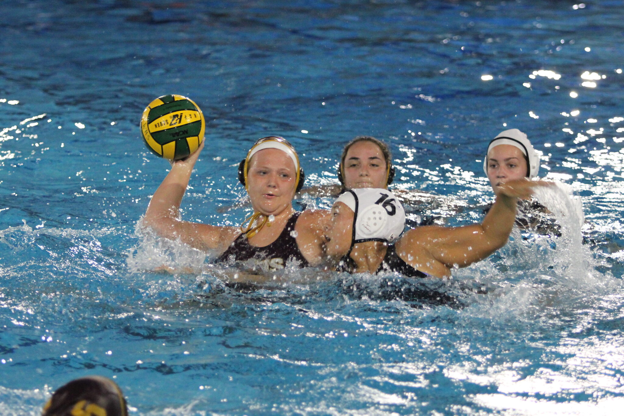 Avery MeGargee whips in a shot with the defender draped on her