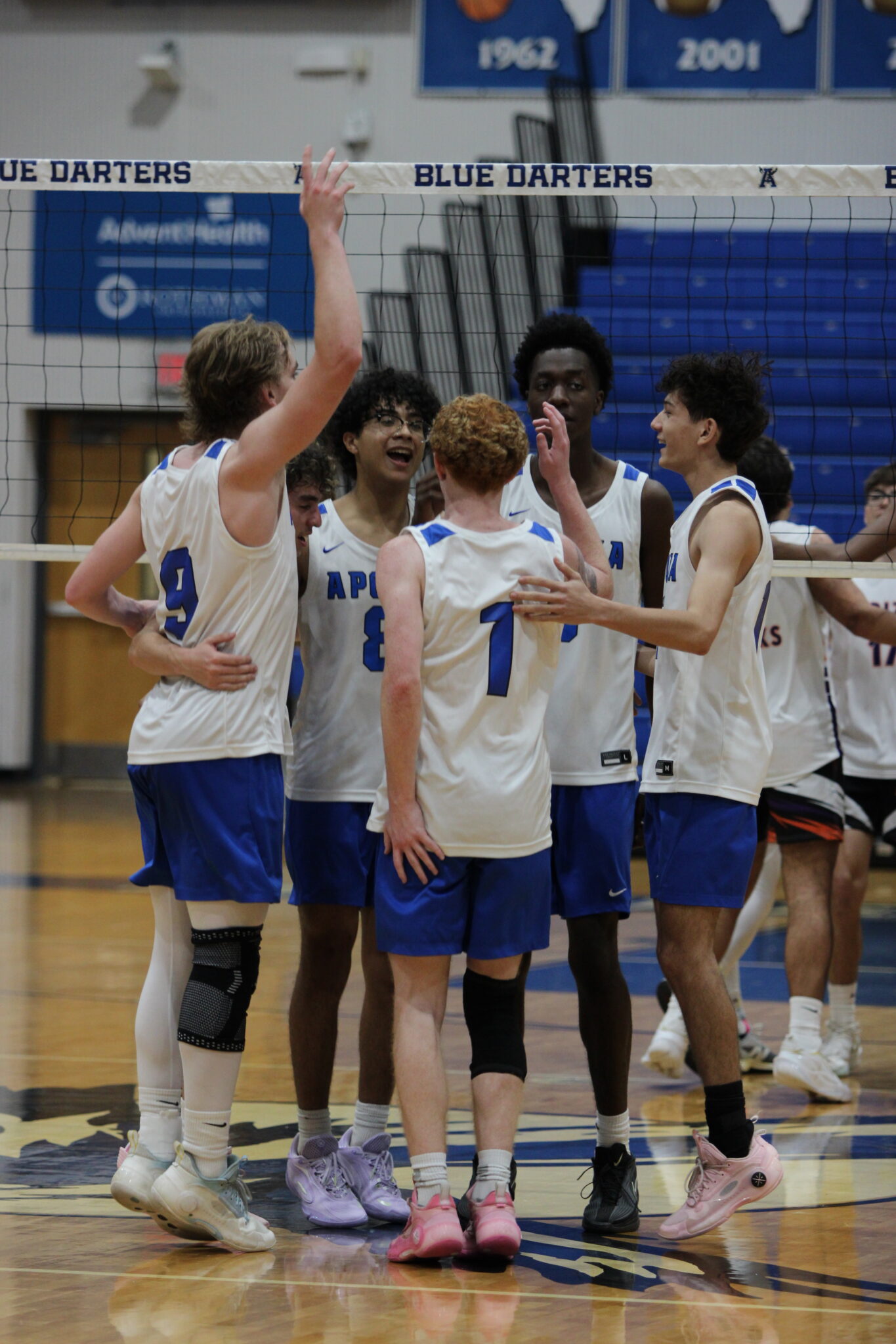 Blue Darters celebrate a point in the third set against Horizon