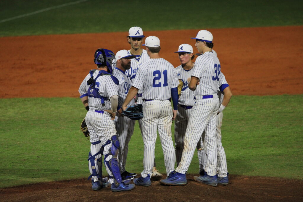 Blue Darters meet at the mound in attempt to recover from Windermere's early rally